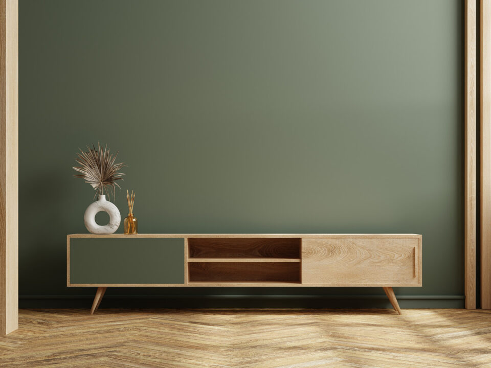 Cabinet for TV on the green color wall in living room,minimal de